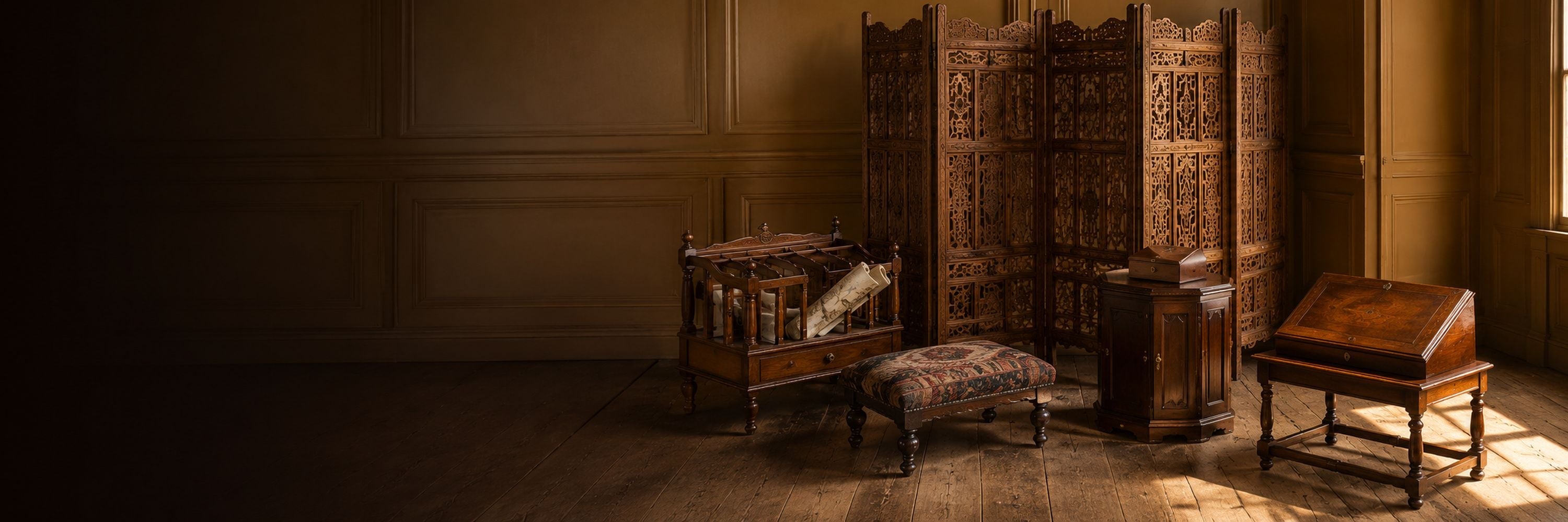 Eclectic antique furniture featuring a carved folding screen, Canterbury rack, upholstered footstool, small cabinet and writing slope