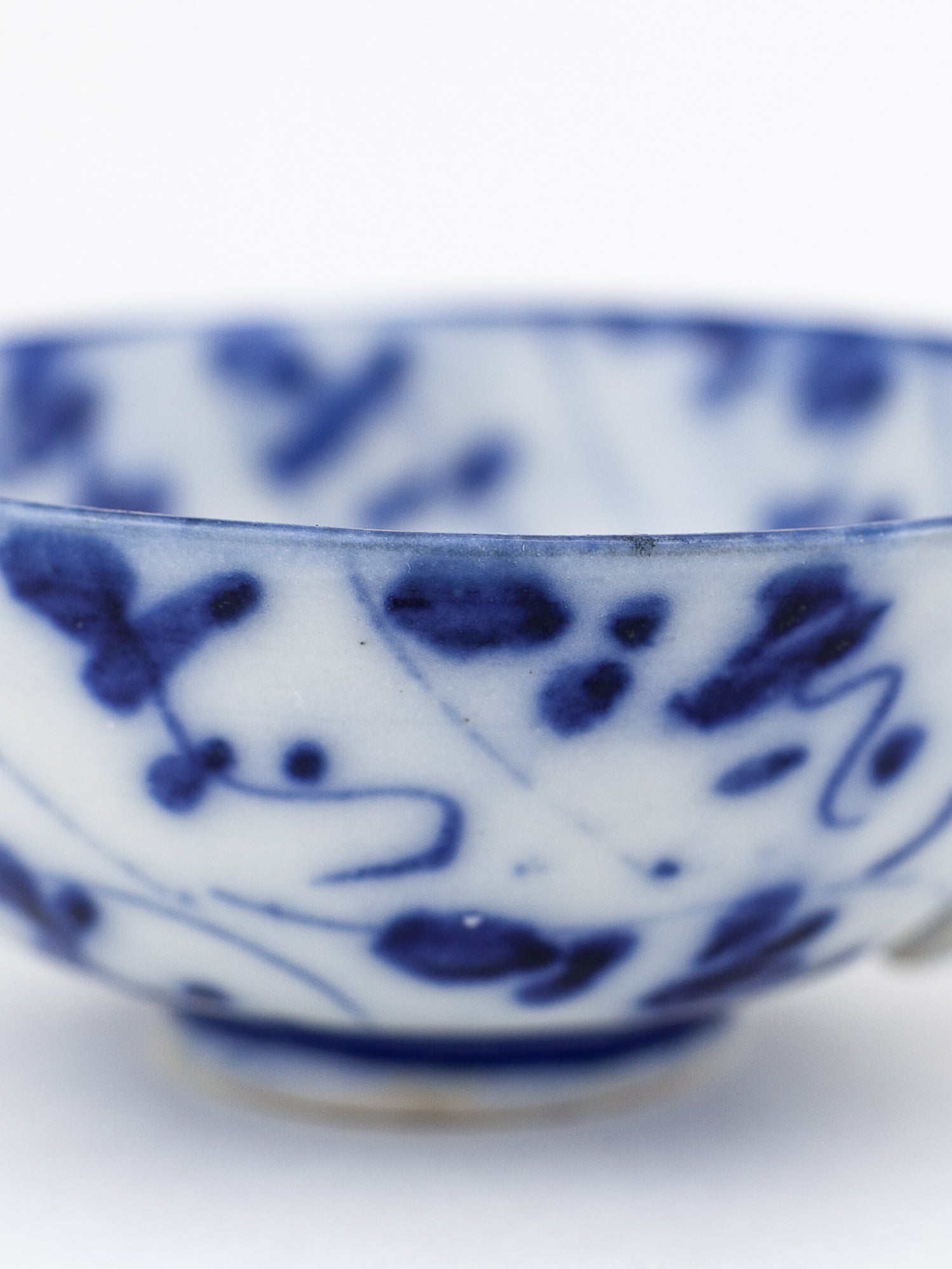 Chinese Qing Dynasty Blue & White Spiral Lotus Teacup & Saucer
