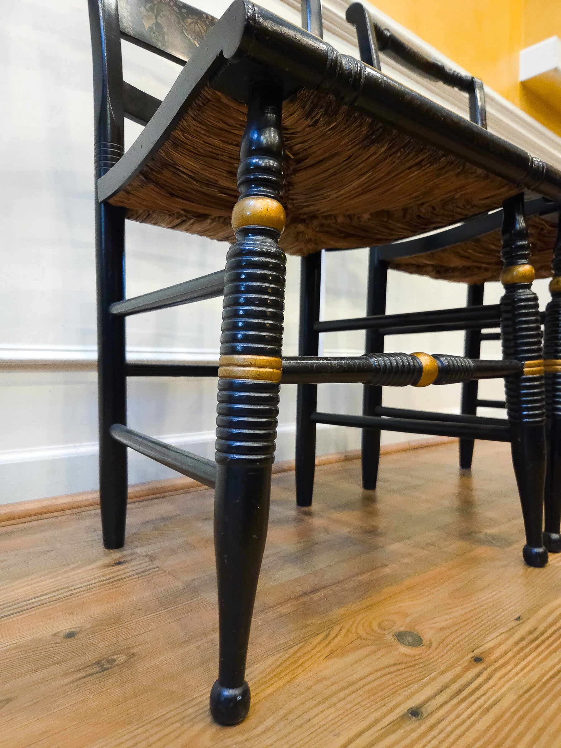 Pair of Vintage Hitchcock Black Painted Stenciled Side Chairs with Rush Woven Seats