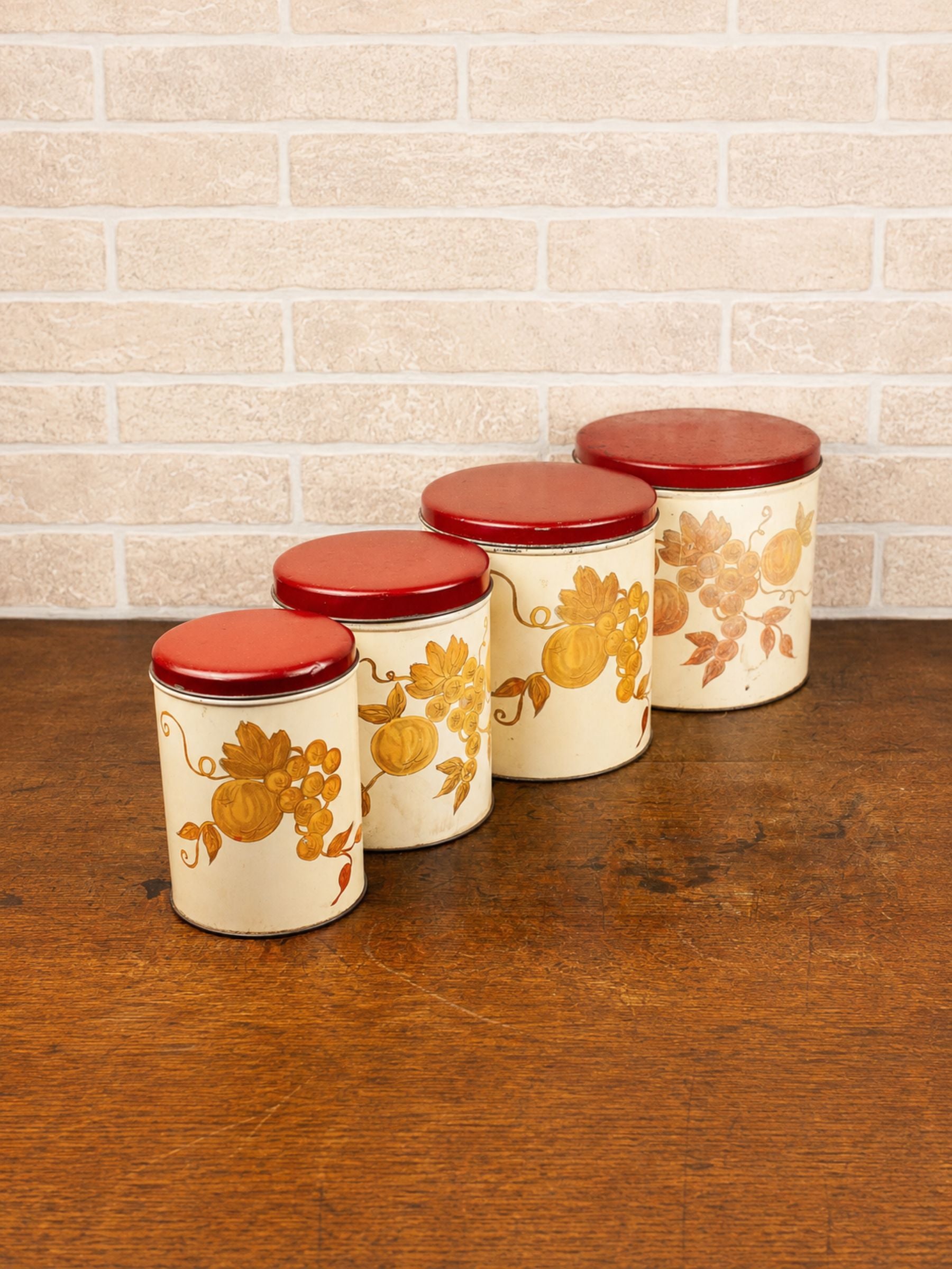 Set of Four Vintage Nesting Kitchen Canisters with Fruit Decoration
