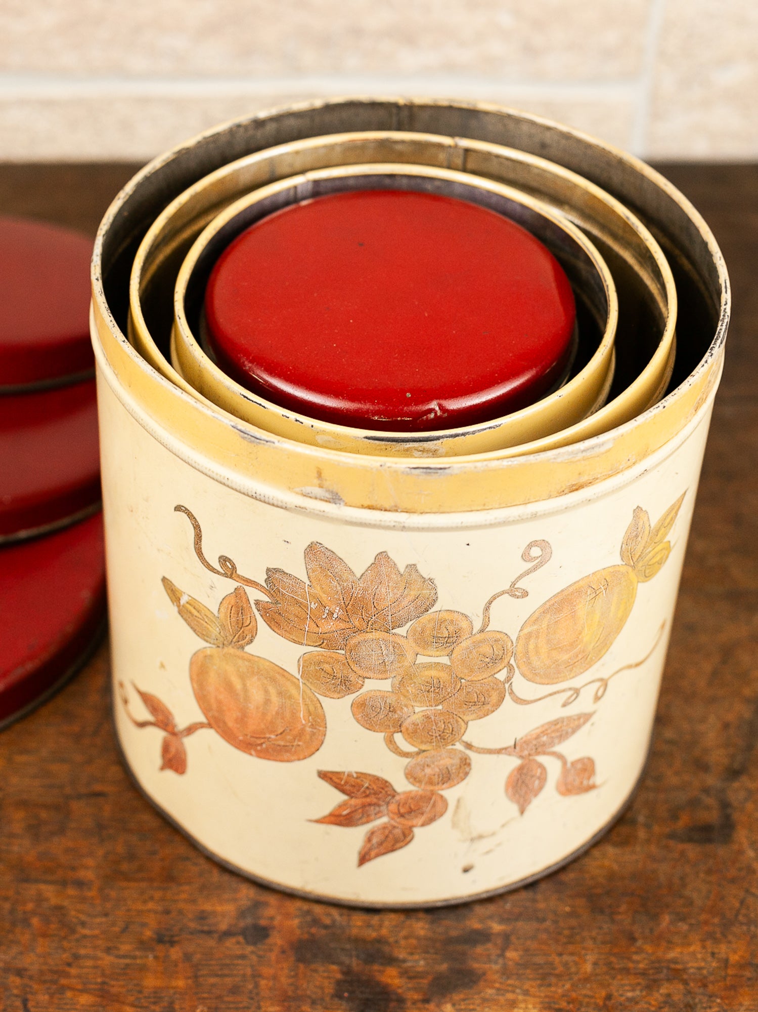 Set of Four Vintage Nesting Kitchen Canisters with Fruit Decoration