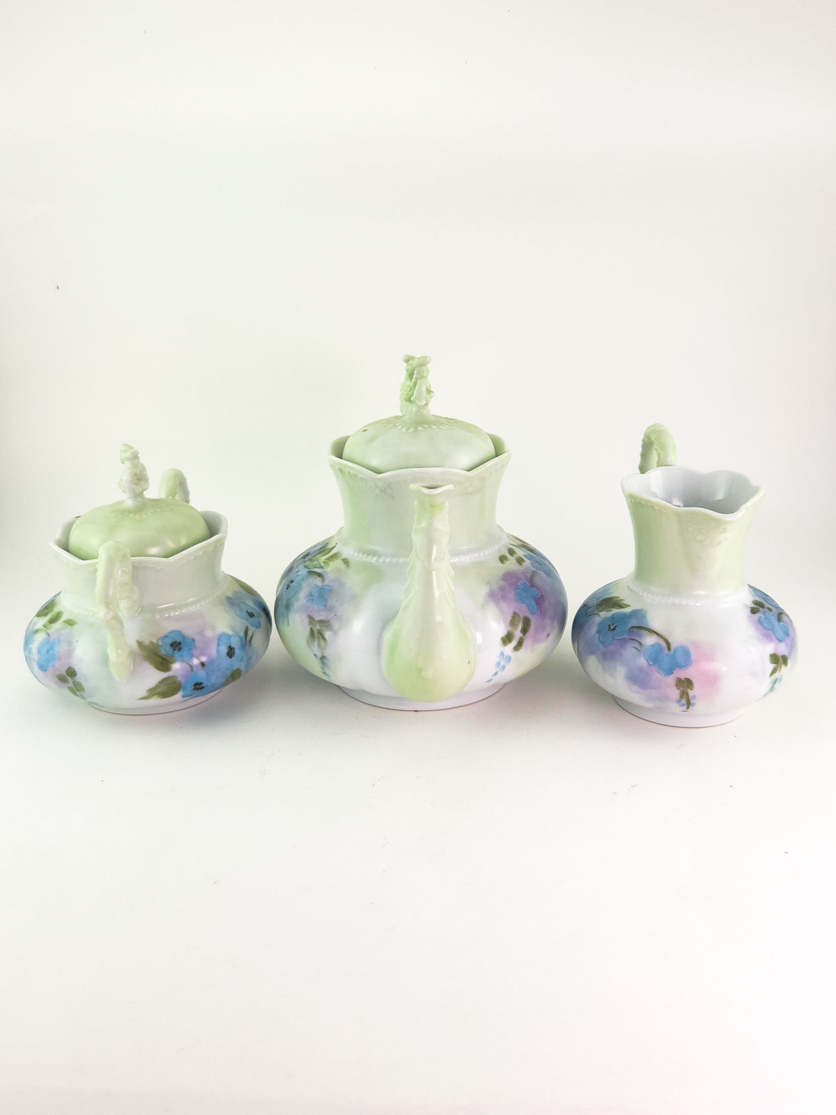 Hand-Painted Porcelain Three-Piece Tea Set with Floral Decoration