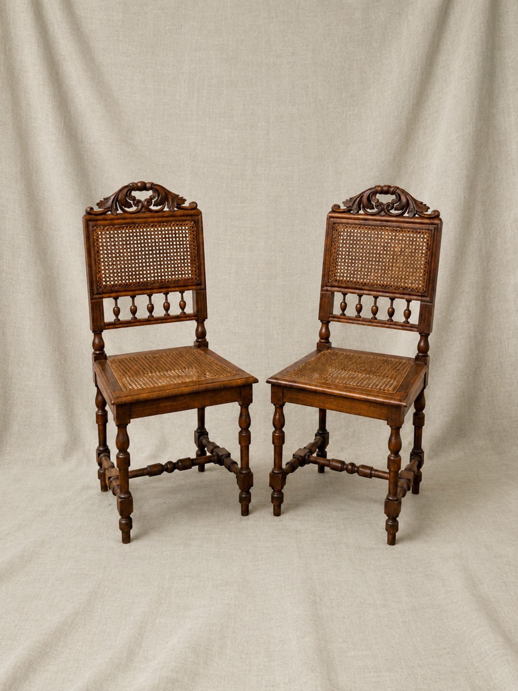 Pair of Antique French Carved Oak Chairs, Late 19th Century with Cane Seats and Backs.