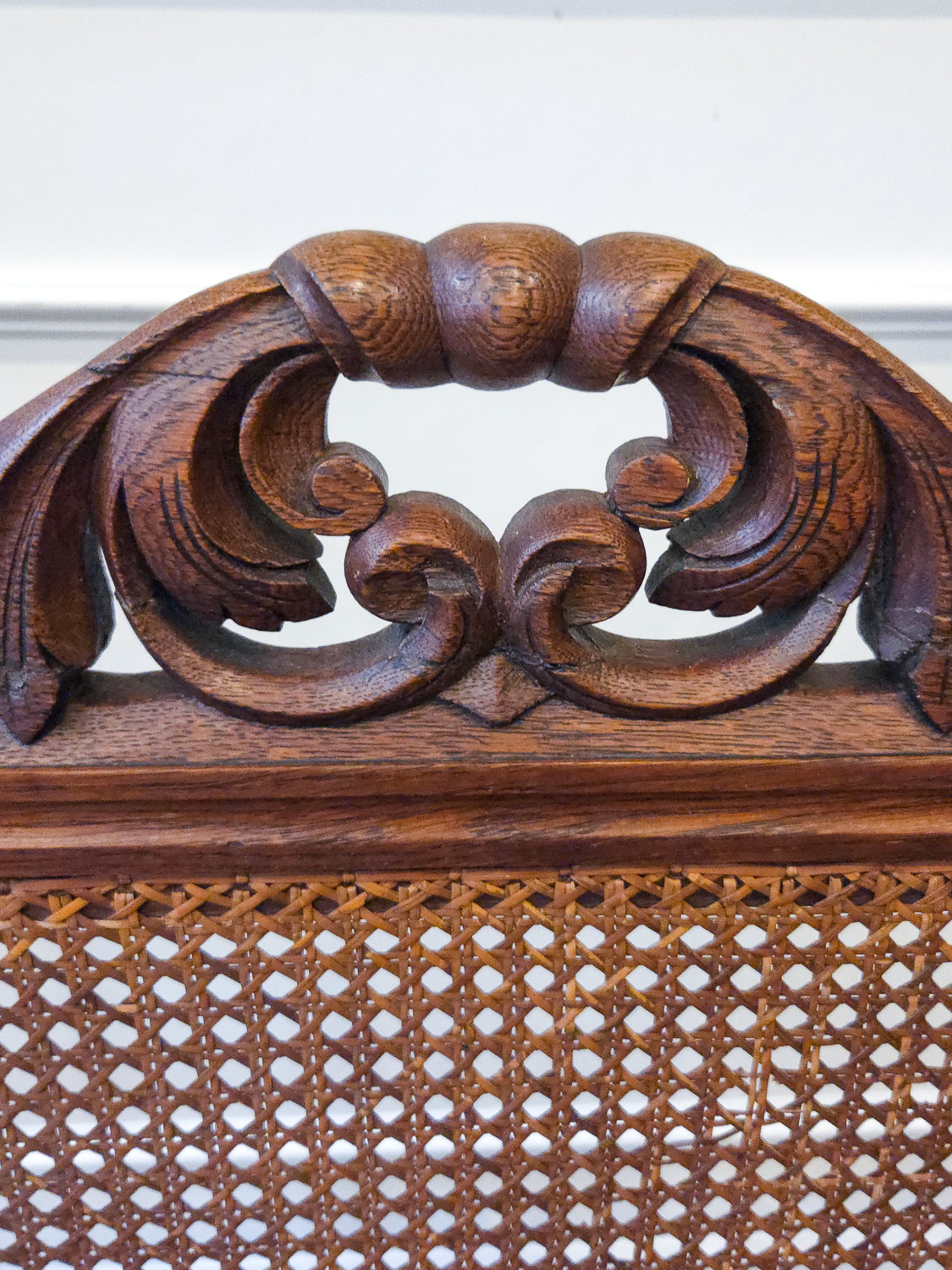 Pair of Antique French Carved Oak Chairs, Late 19th Century with Cane Seats and Backs.