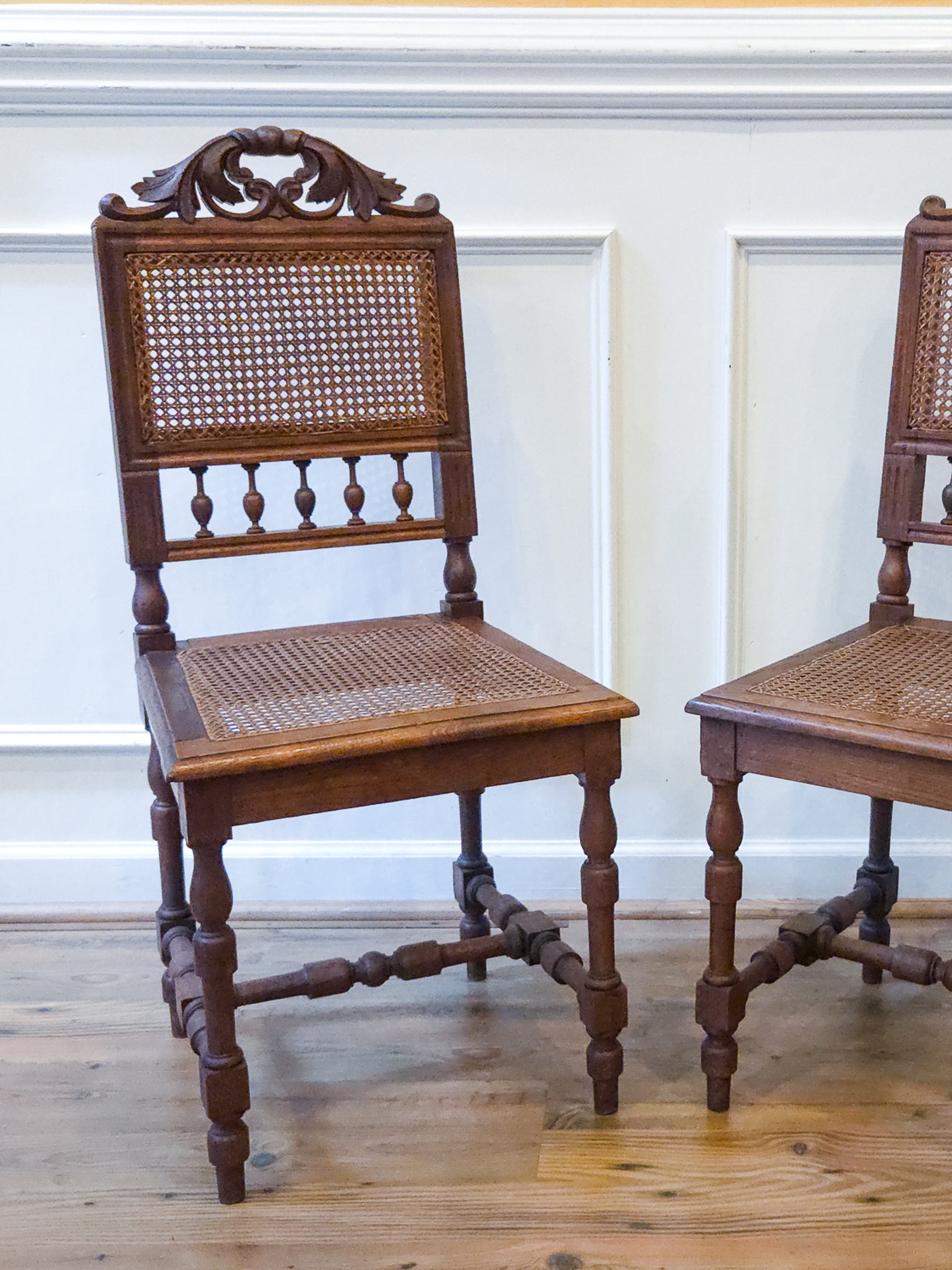 Pair of Antique French Carved Oak Chairs, Late 19th Century with Cane Seats and Backs.