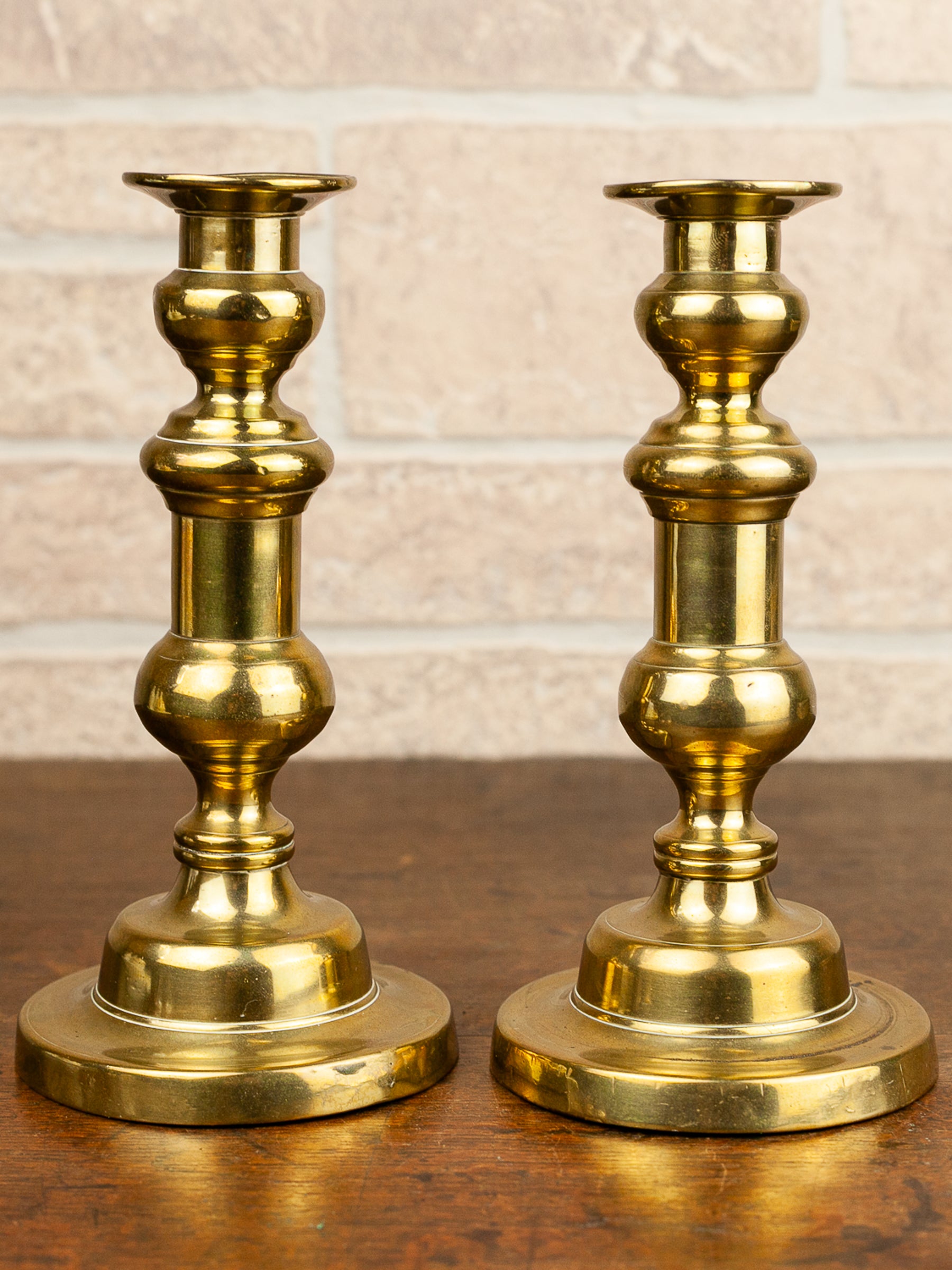 Pair of 19th Century English Brass Push-Up Candlesticks