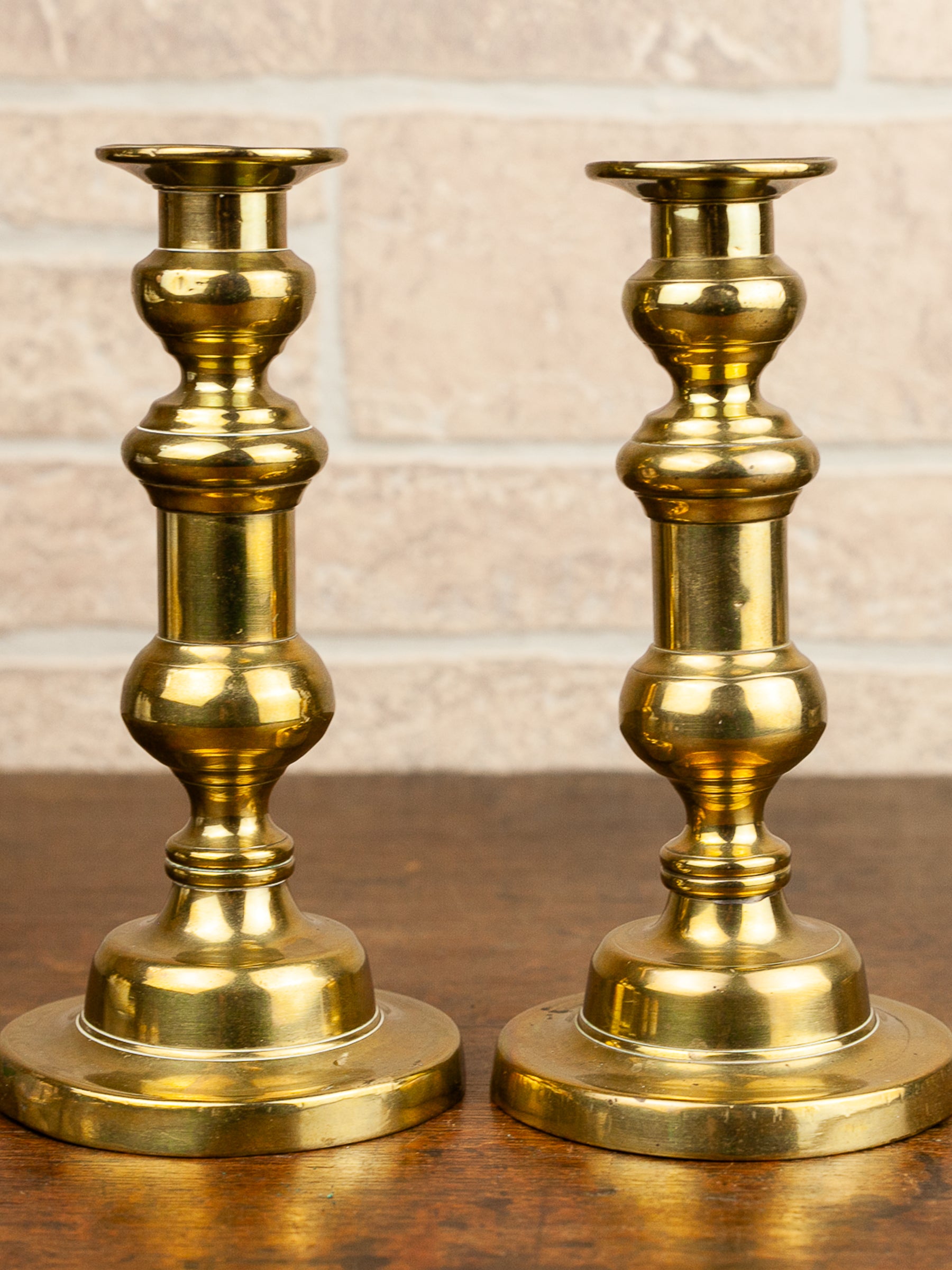 Pair of 19th Century English Brass Push-Up Candlesticks