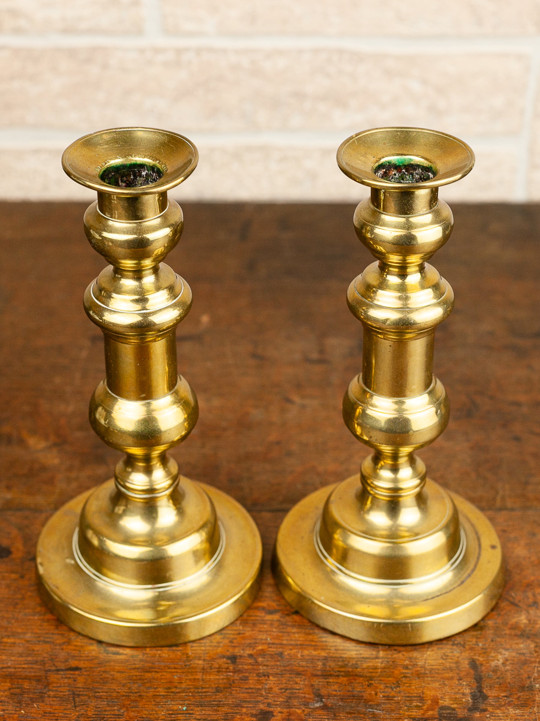 Pair of 19th Century English Brass Push-Up Candlesticks