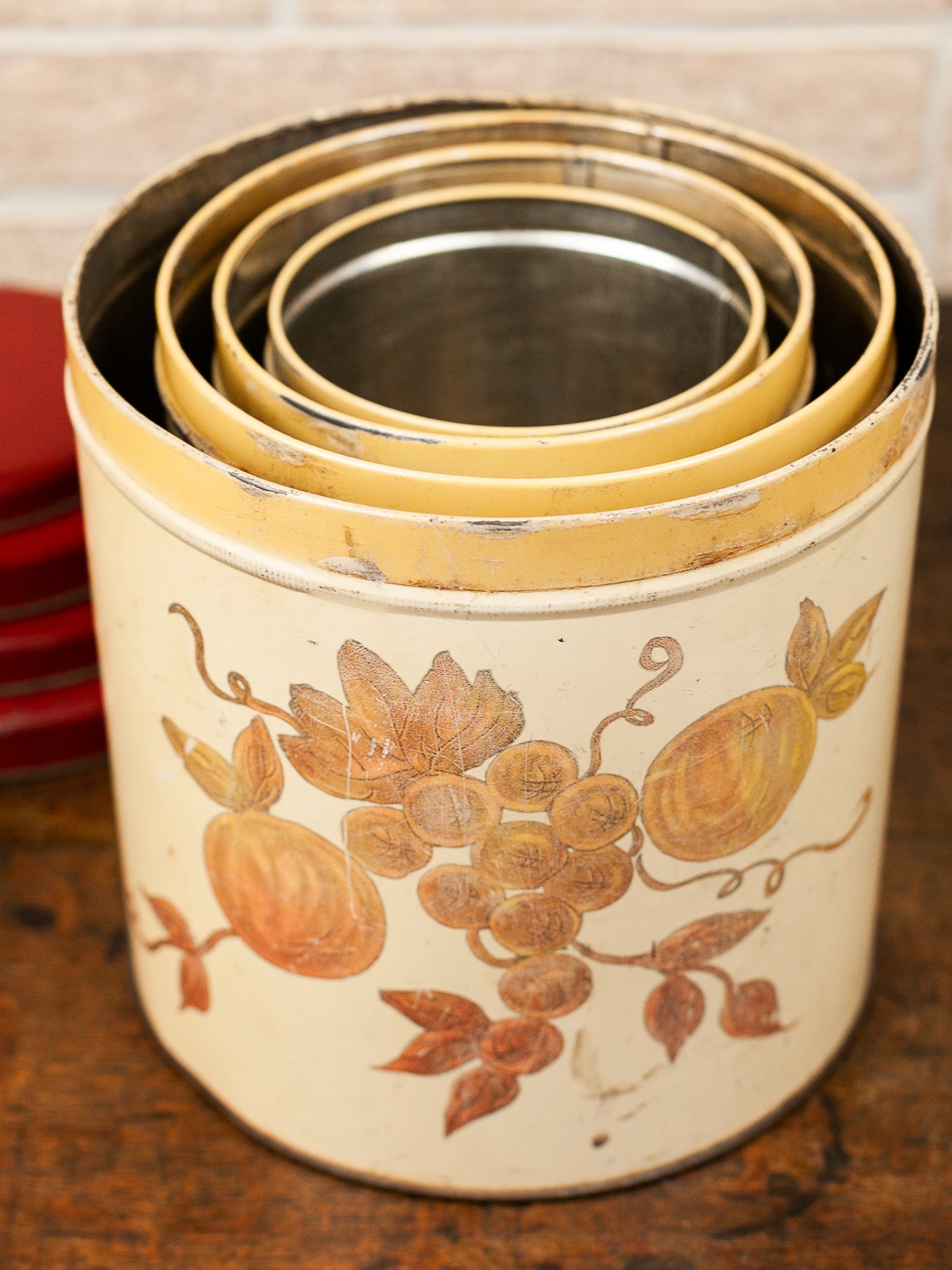 Set of Four Vintage Nesting Kitchen Canisters with Fruit Decoration