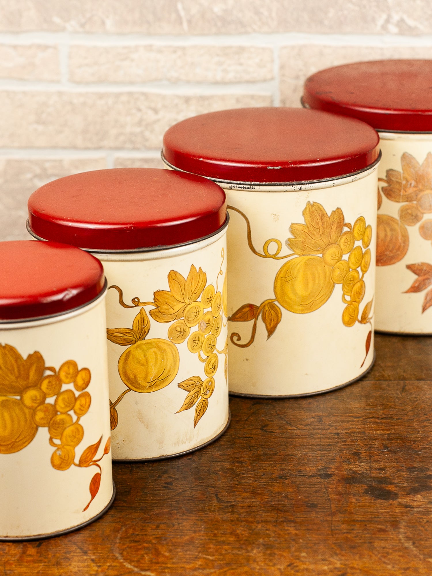 Set of Four Vintage Nesting Kitchen Canisters with Fruit Decoration