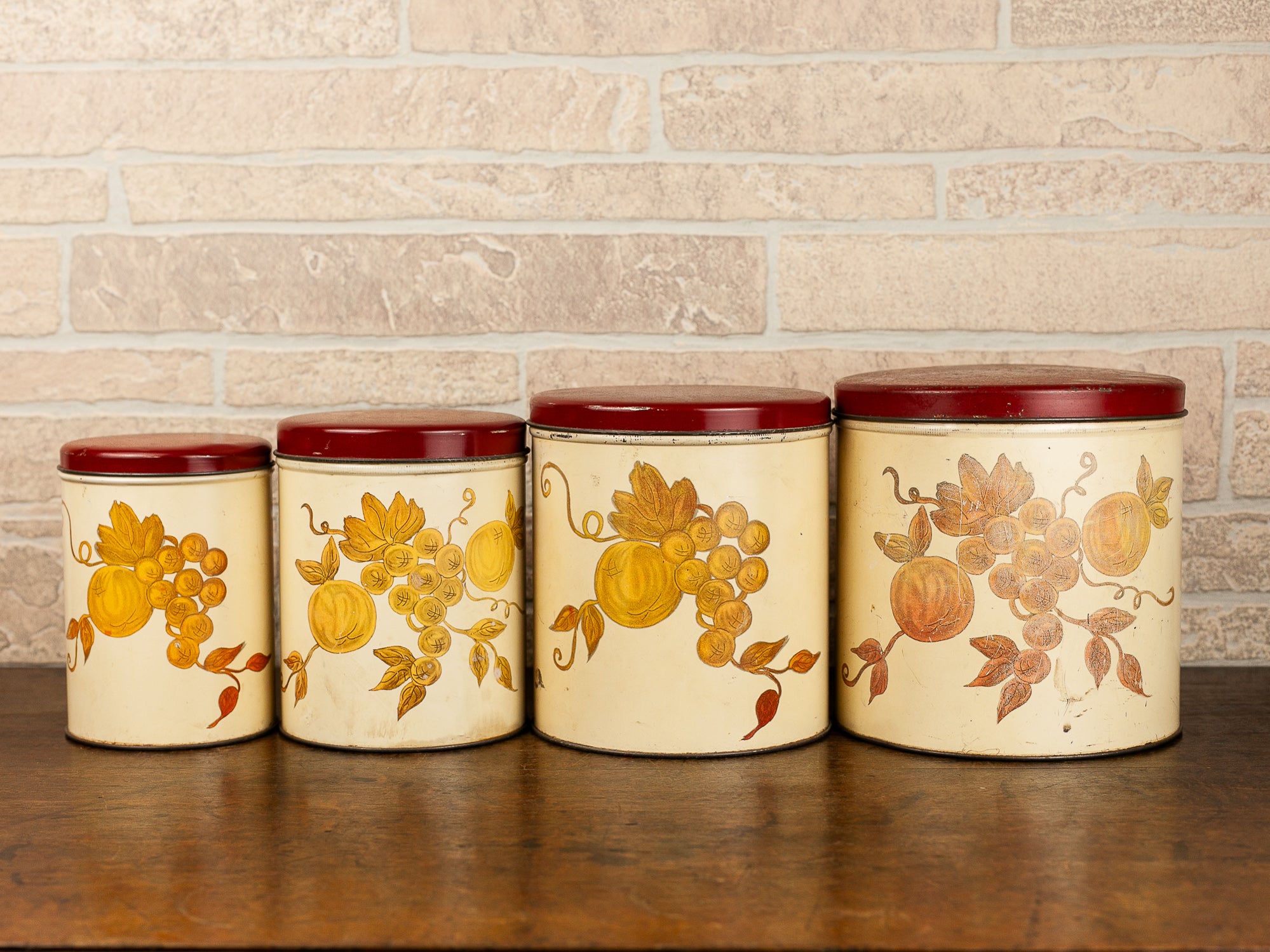 Set of Four Vintage Nesting Kitchen Canisters with Fruit Decoration