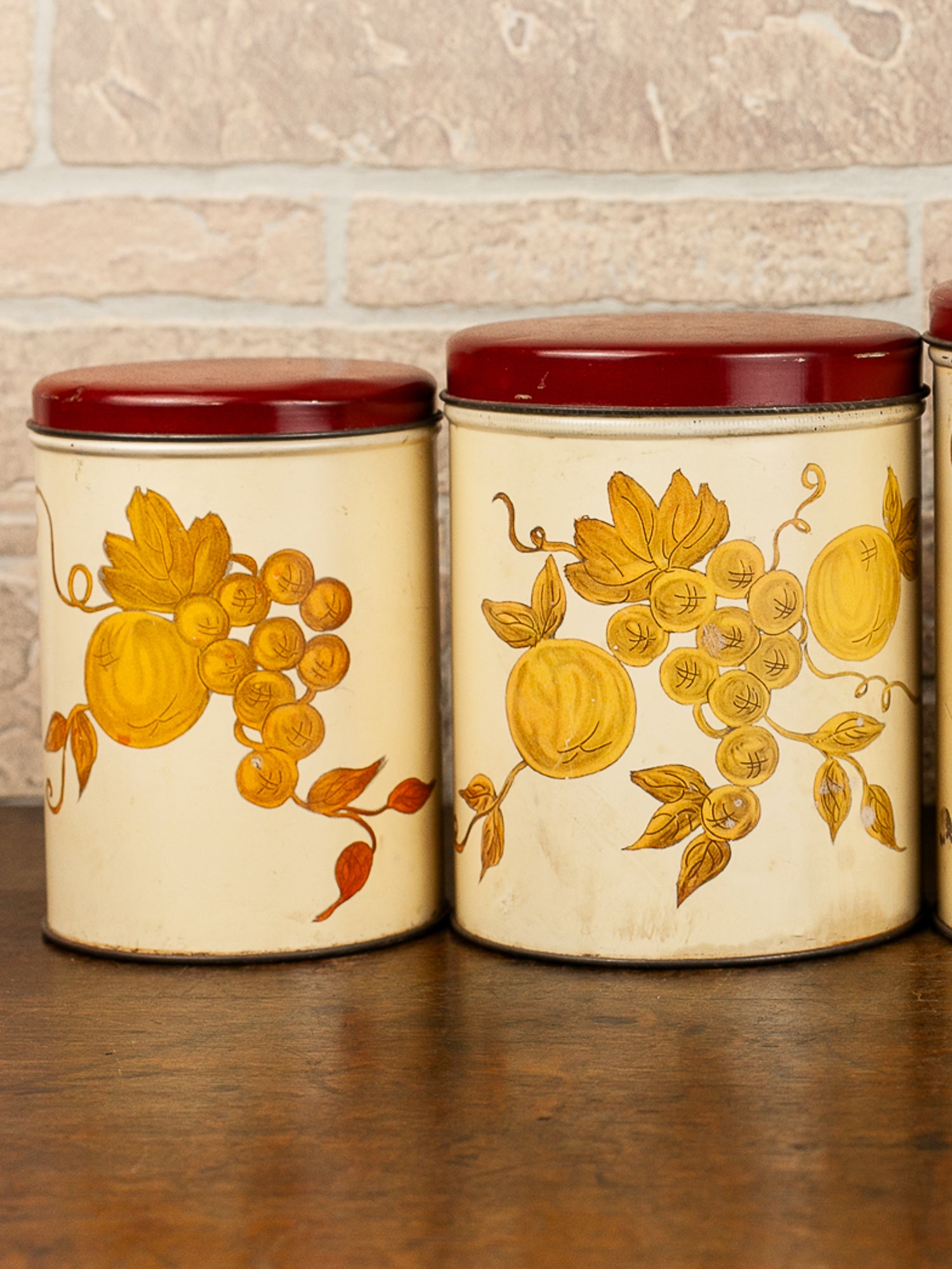 Set of Four Vintage Nesting Kitchen Canisters with Fruit Decoration