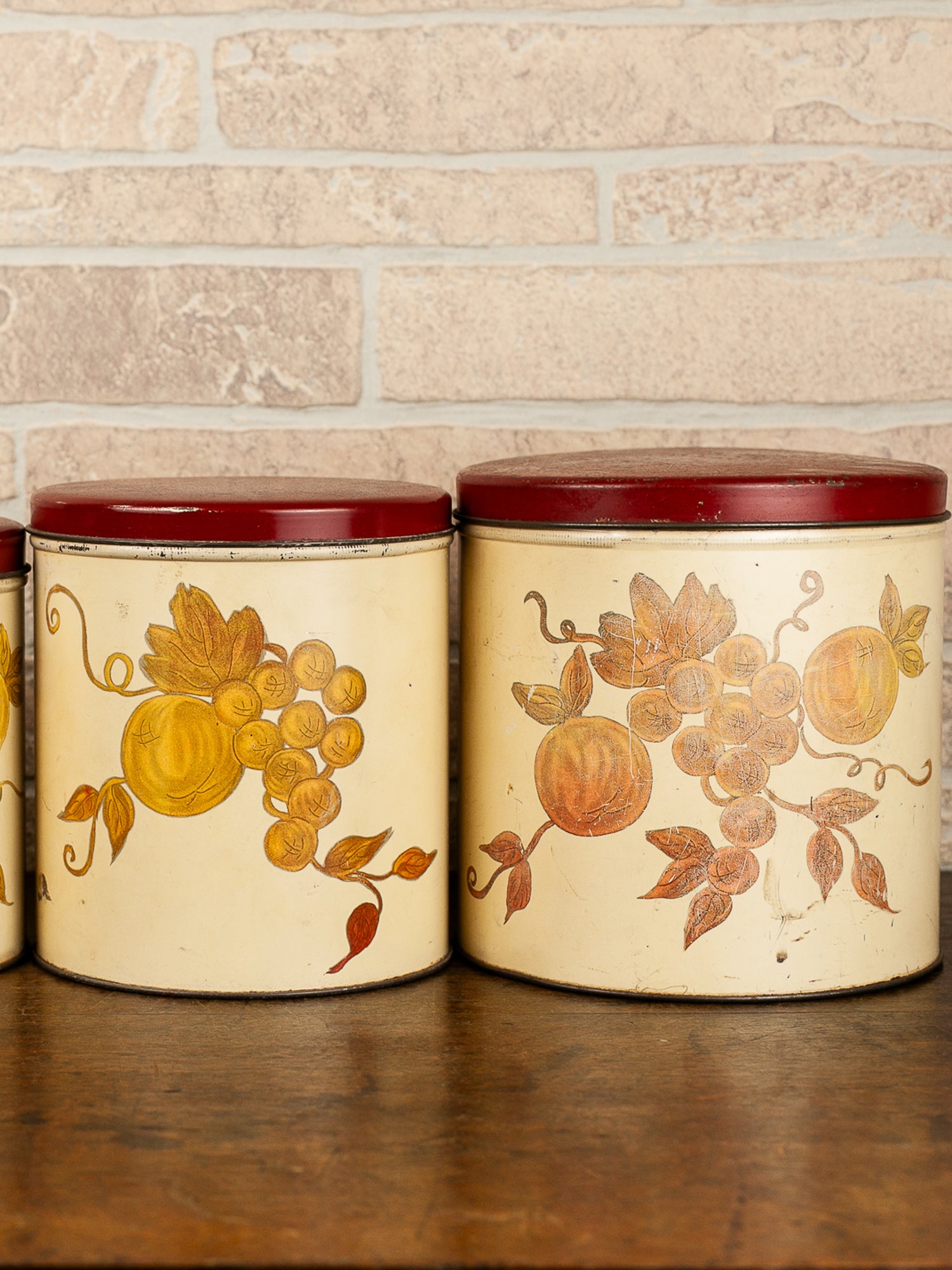 Set of Four Vintage Nesting Kitchen Canisters with Fruit Decoration