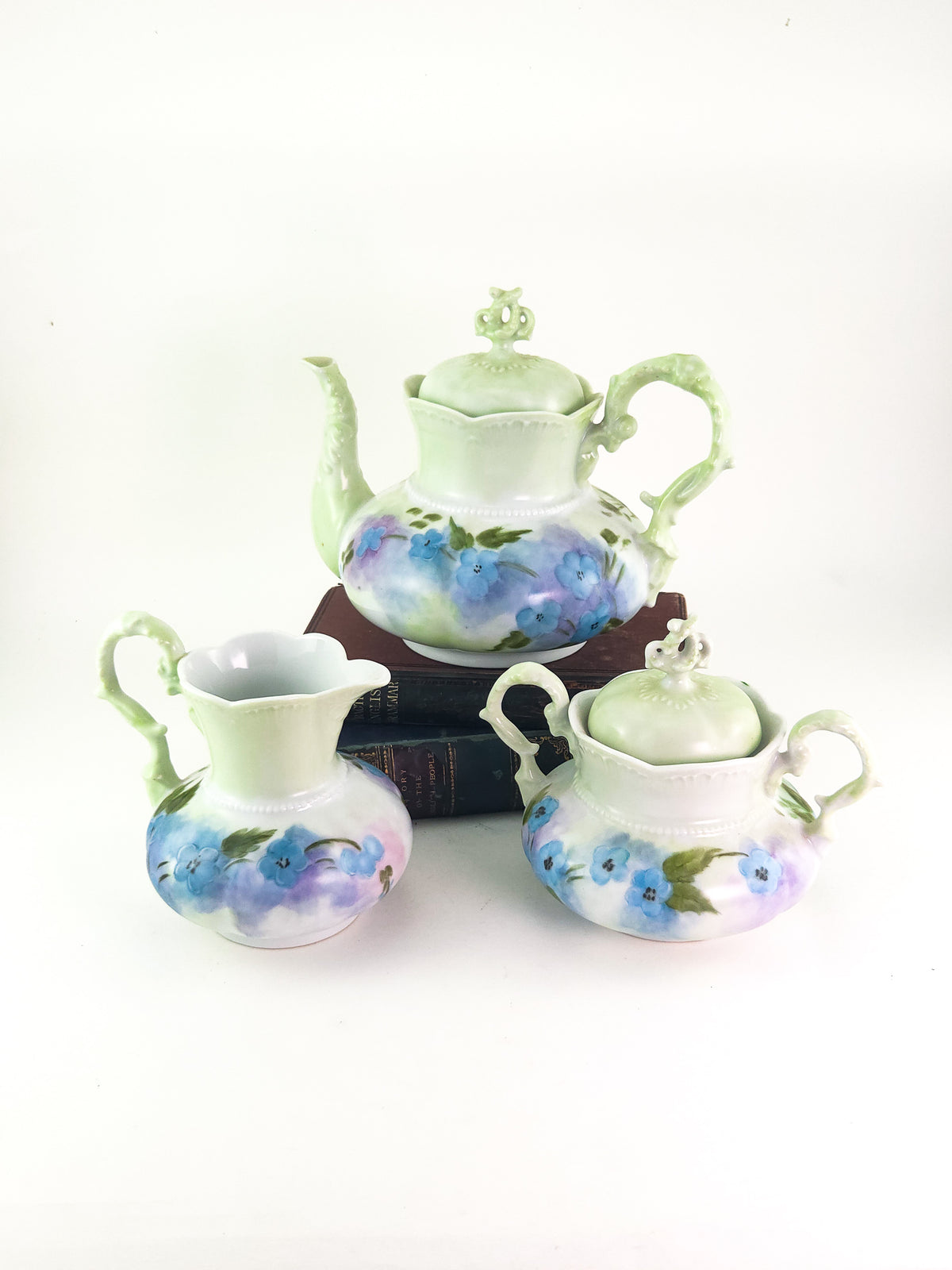 Hand-Painted Porcelain Three-Piece Tea Set with Floral Decoration