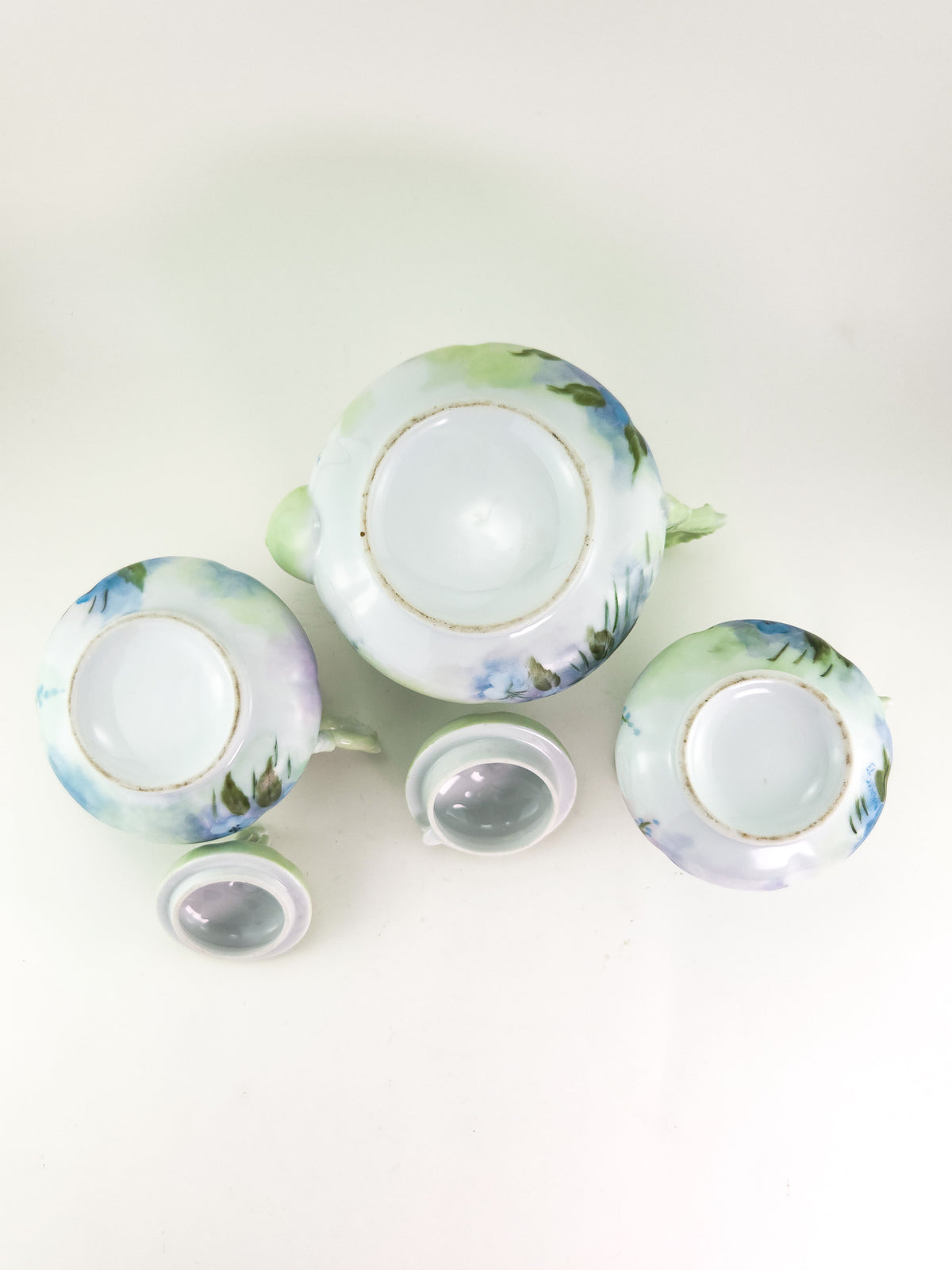 Hand-Painted Porcelain Three-Piece Tea Set with Floral Decoration