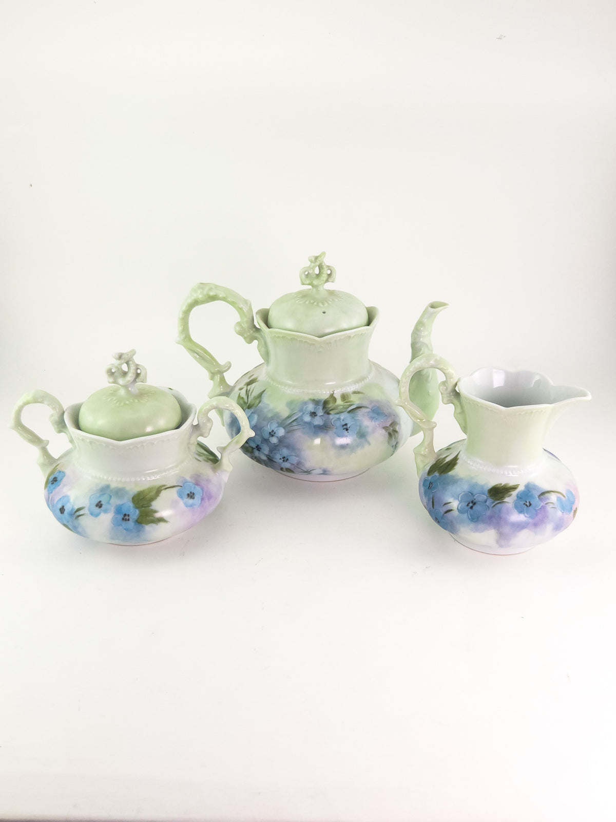 Hand-Painted Porcelain Three-Piece Tea Set with Floral Decoration