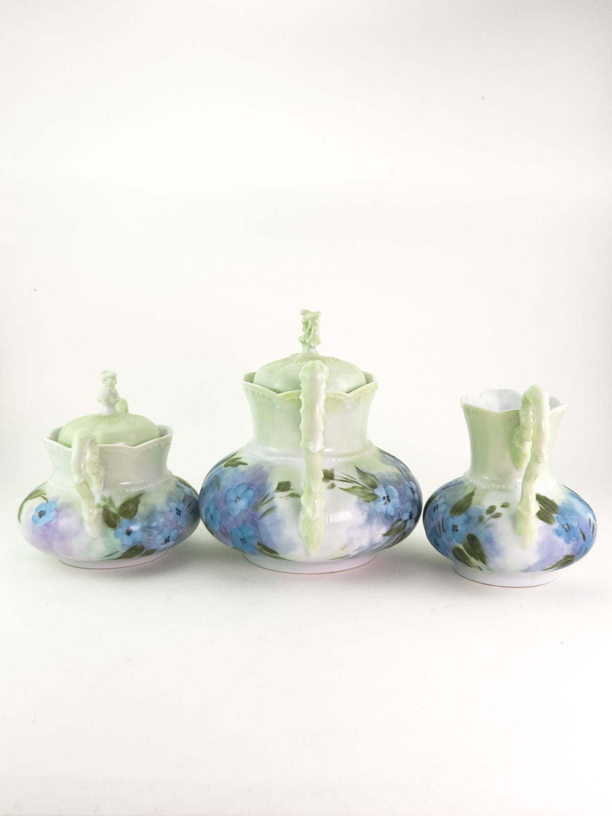 Hand-Painted Porcelain Three-Piece Tea Set with Floral Decoration