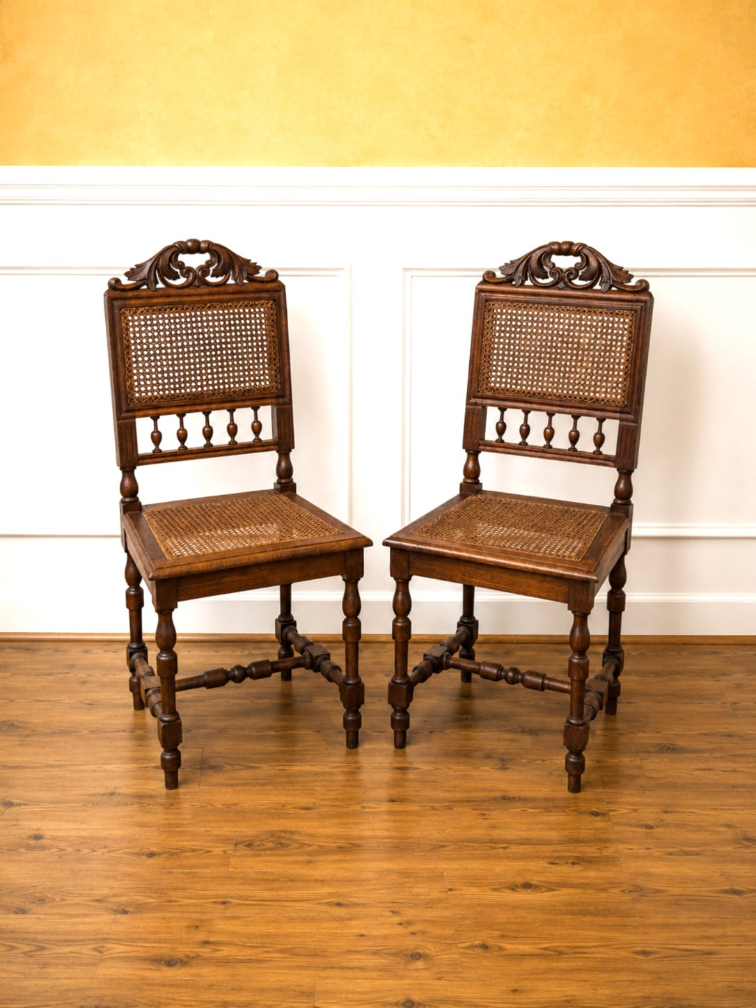 Pair of Antique French Carved Oak Chairs, Late 19th Century with Cane Seats and Backs.