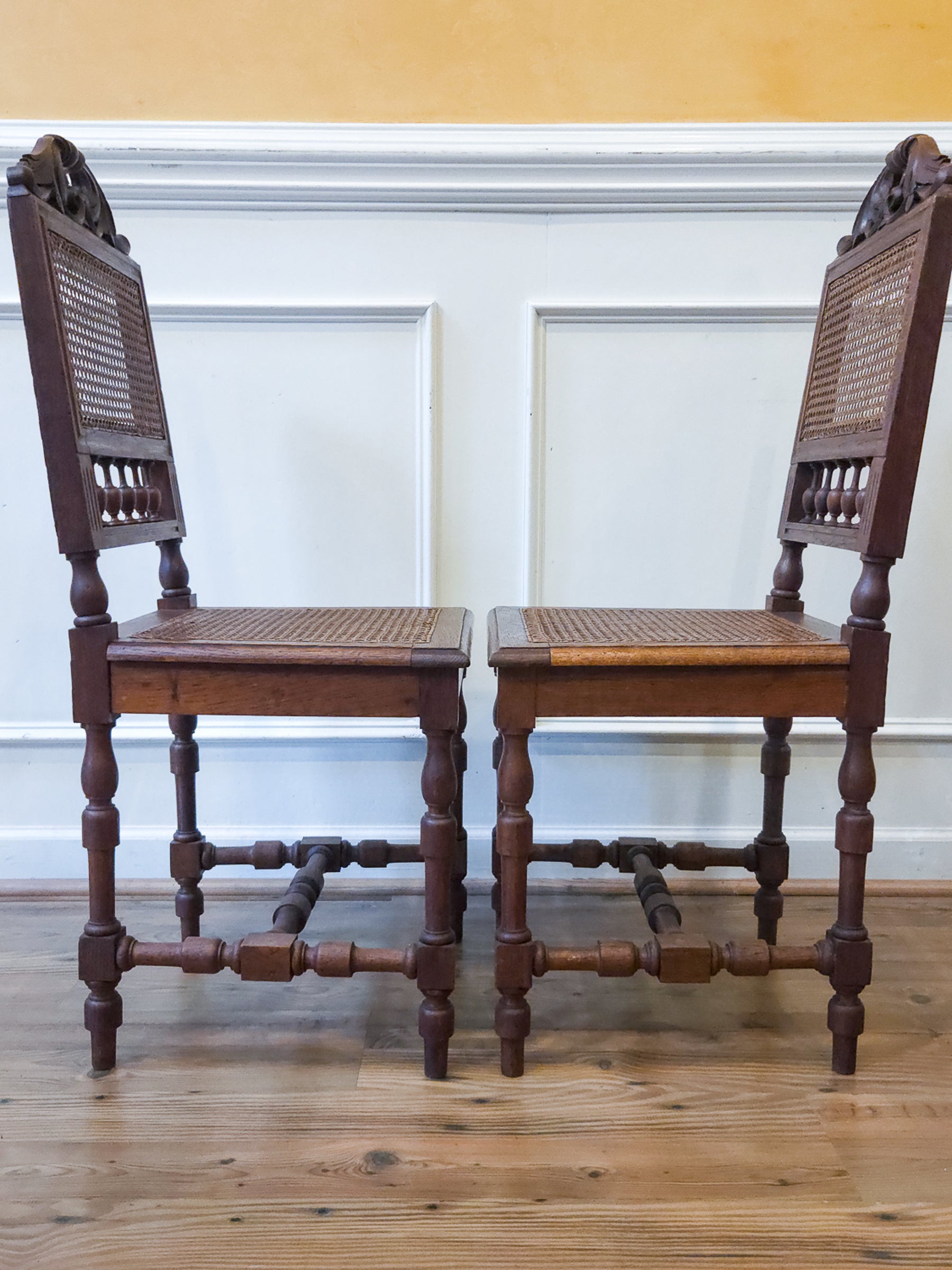 Pair of Antique French Carved Oak Chairs, Late 19th Century with Cane Seats and Backs.