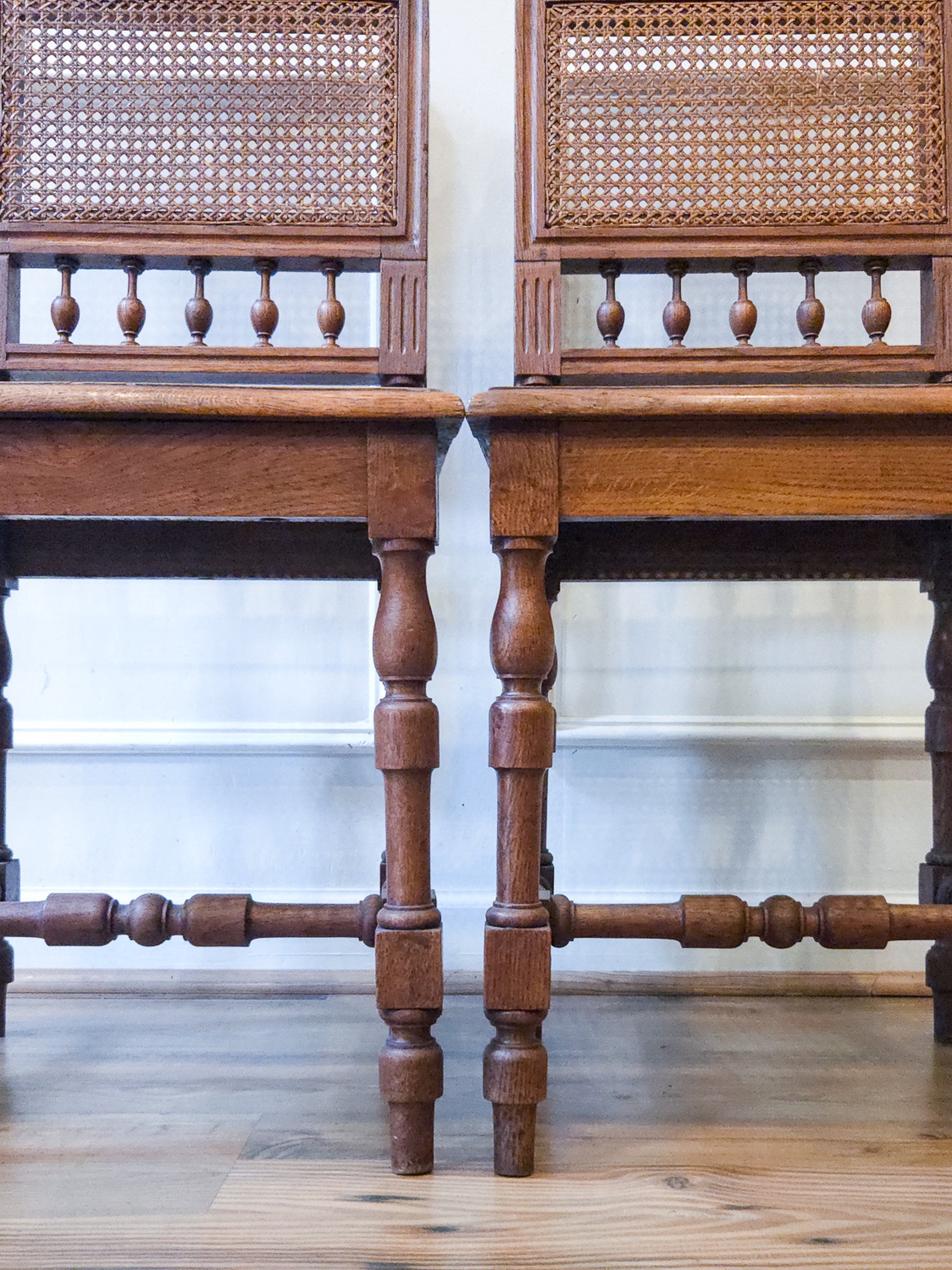 Pair of Antique French Carved Oak Chairs, Late 19th Century with Cane Seats and Backs.
